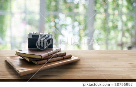 vintage film photo camera with letther book on wood table in banne vintage film photo camera with letther book on wood table in banne 88796992