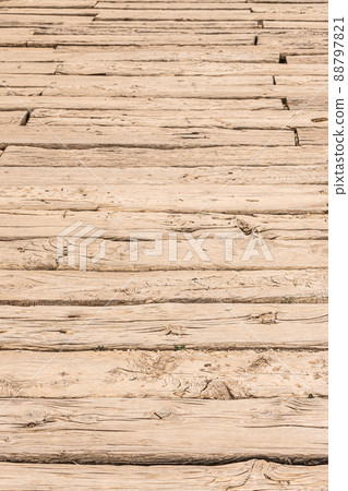 Textured background of uneven brown wooden boards Textured background of uneven brown wooden boards 88797821