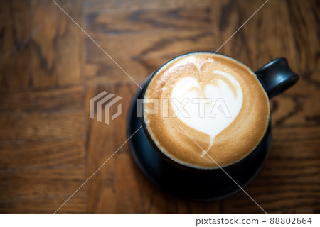 cappuccino or Latte art coffee made from milk on wood table cappuccino or Latte art coffee made from milk on wood table 88802664