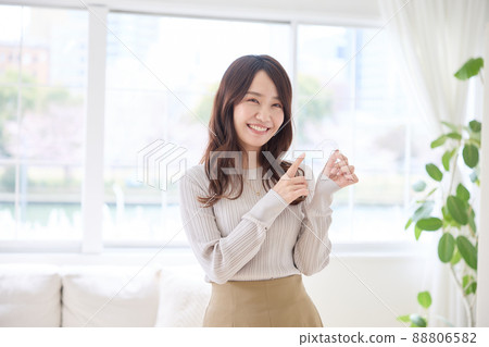 Woman doing mouthpiece correction 88806582