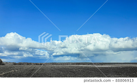 Sowing time in Ukraine during the war. Preparing fields for sowing grain. Blue sky, plowed land. terror. Sowing time in Ukraine during the war. Preparing fields for sowing grain. Blue sky, plowed land. terror. 88806913