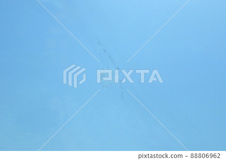 Cracks in the windshield of a car (after repair) 88806962