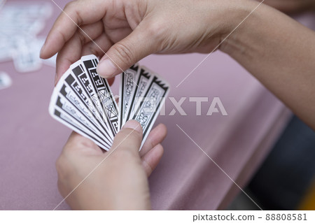 chinese playing cards on abstract background chinese playing cards on abstract background 88808581
