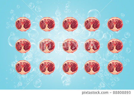 Symmetrical composition of pomegranate slices on blue background. Top view. Symmetrical composition of pomegranate slices on blue background. Top view. 88808893