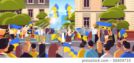 people protesters holding Ukrainian flags pray for Ukraine peace save Ukraine from russia stop war concept people protesters holding Ukrainian flags pray for Ukraine peace save Ukraine from russia stop war concept 88809710