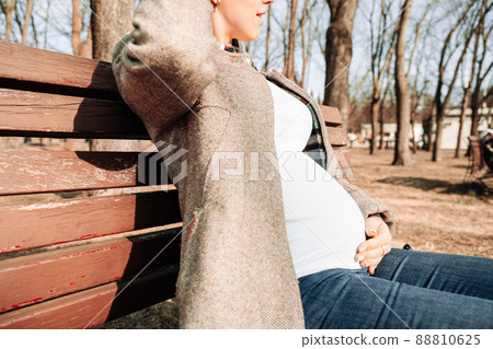Pregnancy nature woman walk. Happy maternity mother in summer park. Baby belly. Pregnant walking nature. Concept maternity, pregnancy, childbirth. 88810625