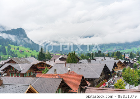 Chalets in the village of Gstaad in autumn time Chalets in the village of Gstaad in autumn time 88811379