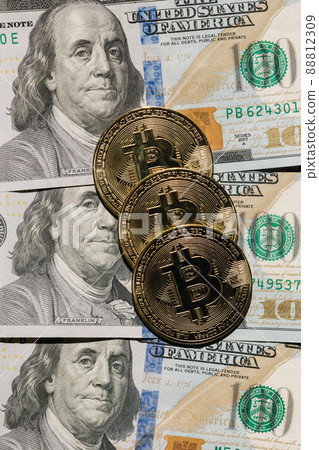 Bitcoin on banknotes of one hundred dollars. Exchange US dollars for bitcoin. Cryptocurrency on dollar bills. Digital modern method of payment. Concep of virtual money. Bitcoin on banknotes of one hundred dollars. Exchange US dollars for bitcoin. Cryptocurrency on dollar bills. Digital modern method of payment. Concep of virtual money. 88812309