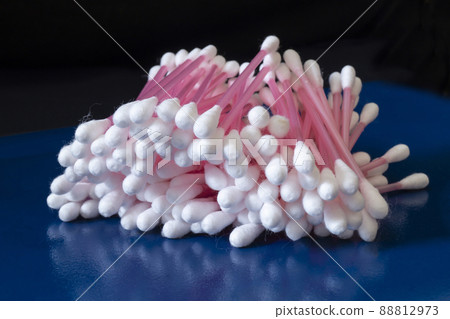 Hygienic cotton swabs on a blue table Hygienic cotton swabs on a blue table 88812973