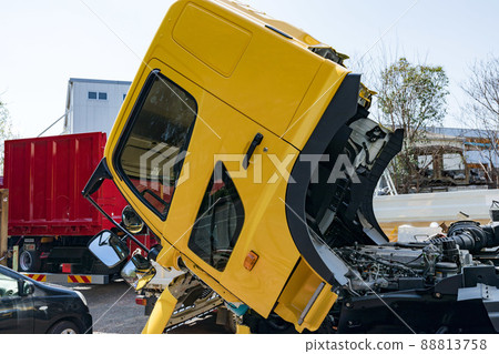 Yellow heavy truck under repair 88813758