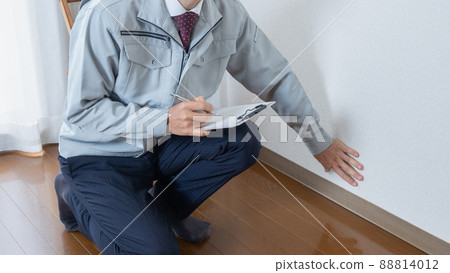 Workers inspecting floors and wallpaper | Remodeling survey / estimate image 88814012