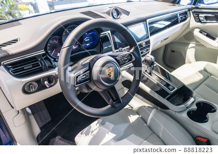 Porsche Macan interior - steering wheel with logo and buttons, dashboard and speedometer Porsche Macan interior - steering wheel with logo and buttons, dashboard and speedometer 88818223