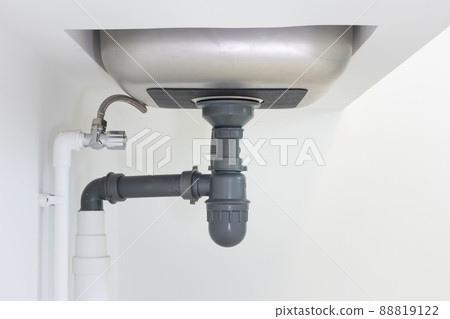 Drain pipe or sewer under kitchen sink in drainage system. Drain pipe or sewer under kitchen sink in drainage system. 88819122
