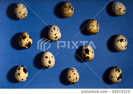 Creative quail egg layout on blue background. Quail eggs pattern. Happy easter concept. 88819329