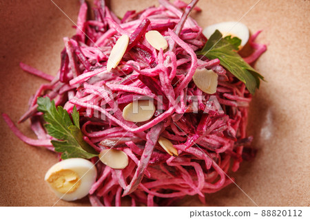 Daikon and beet salad dressed with mayonnaise or yogurt, garnished with almonds and quail eggs 88820112