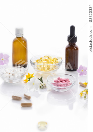 Various vitamin capsules and dietary supplements isolated on white background, vertical format. Vitamin complexes concept. Various vitamin capsules and dietary supplements isolated on white background, vertical format. Vitamin complexes concept. 88820324