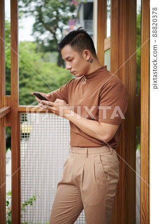 Aapathetic Asian Young Man Doomscrolling 88820378