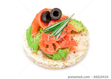 Rice Cake Sandwich with Fresh Salmon, Avocado and Olives - Isolated Rice Cake Sandwich with Fresh Salmon, Avocado and Olives - Isolated 88820416