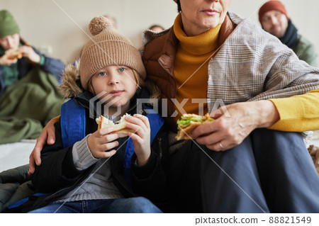 Little Boy with Mother in Shelter 88821549