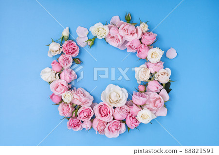 Floral frame with roses buds and petals, color creative background 88821591