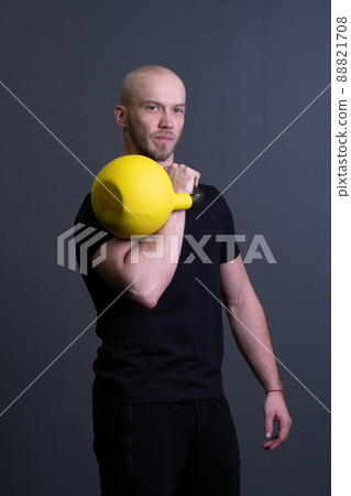 Guy with a yellow kettlebell gym anonymous yellow man, in the afternoon motivation effort for painted for up weightlifting, asian fitness. Healthy down endurance, circuit hiit Guy with a yellow kettlebell gym anonymous yellow man, in the afternoon motivation effort for painted for up weightlifting, asian fitness. Healthy down endurance, circuit hiit 88821708