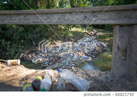 Pollution floating in tropical river Pollution floating in tropical river 88821730