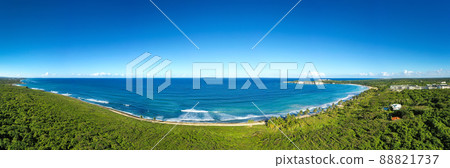 Macao beach with sandy coastline, turquoise water and stone cliff. Dominican Republic. Aerial panorama view 88821737