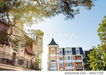 Crop of building facade with windows and roof at sunny day 88821790