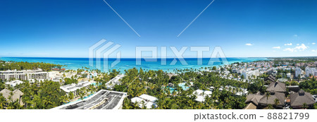 Caribbean coastline of Atlantic ocean with luxury resorts, palm trees and azure water. travel destination. Aerial panorama view 88821799