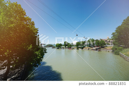 Kura river on Rike park on bright sunny day Kura river on Rike park on bright sunny day 88821831