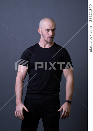 A guy standing in a black T-shirt is a beautiful sexy athlete handsome black man design fit, for healthy chest for lifestyle from fitness people, background studio. Abs fashion standing, sexy adult A guy standing in a black T-shirt is a beautiful sexy athlete handsome black man design fit, for healthy chest for lifestyle from fitness people, background studio. Abs fashion standing, sexy adult 88821849