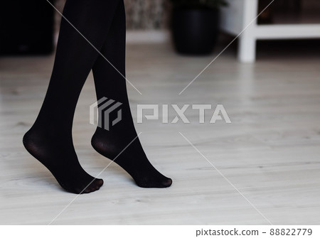 woman in black nylon tights woman in black nylon tights 88822779