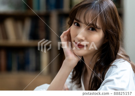 A woman relaxing in a chic living room 88825157