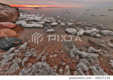 The Last of Winter's Ice Melts Along the Shore of Georgian Bay off the Great Lakes at Twilight 88825236