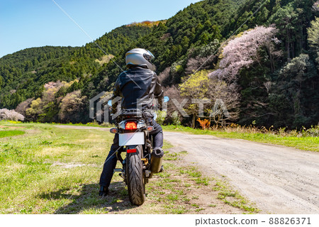 Spring bike touring and rider Unpaved satoyama where trees sprout a-1 Rear line of sight right 88826371