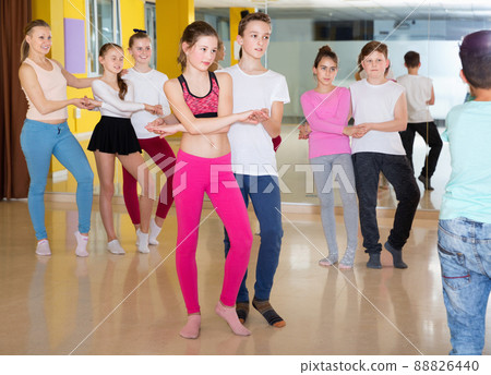 Children dancing rock-and-roll in pairs in choreography class wi Children dancing rock-and-roll in pairs in choreography class wi 88826440