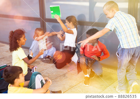 Group of children playing near school 88826535