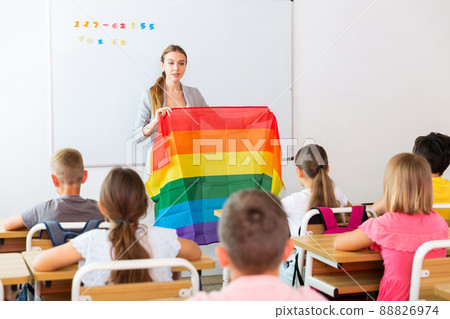 Female teacher discussing with preteen children about LGBT Female teacher discussing with preteen children about LGBT 88826974