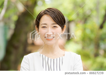 Working woman portrait green background 88827239