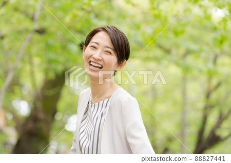 Working woman portrait green background 88827441