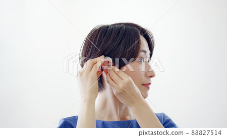 Women wearing hearing aids Women wearing hearing aids 88827514