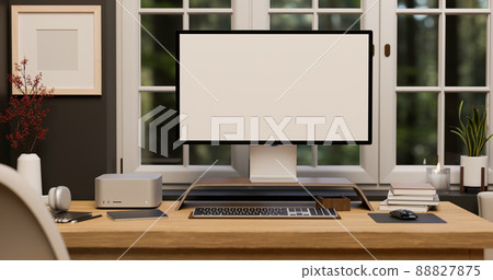 Home office workspace with pc computer on table against the window. Home office workspace with pc computer on table against the window. 88827875