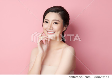 Beautiful young asian woman with clean fresh skin on pink background, Face care, Facial treatment, 88829334