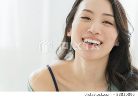 A woman enjoying a pleasant morning A woman enjoying a pleasant morning 88830896