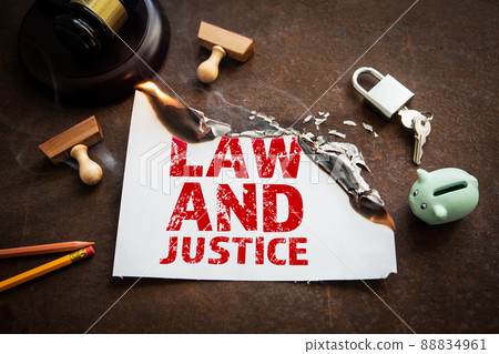 Law and Justice concept. Burning sheet of paper with text 88834961