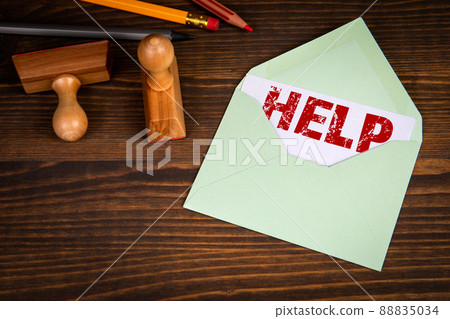 Support concept. Letter, wooden stamps and pencils on the office desk Support concept. Letter, wooden stamps and pencils on the office desk 88835034