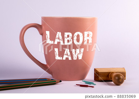Labor law. Coffee mug with text on a white background Labor law. Coffee mug with text on a white background 88835069