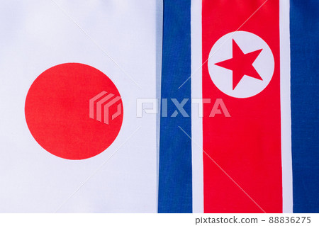 Japan against North Korea flags. Sanctions, war, conflict, Politics and relationship concept Japan against North Korea flags. Sanctions, war, conflict, Politics and relationship concept 88836275