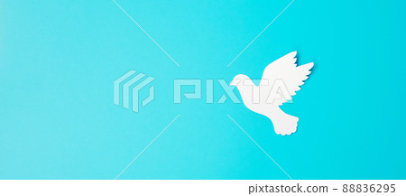 International Day of Peace. white paper Dove bird on blue background. Freedom, Hope and World Peace day 21 September concepts. International Day of Peace. white paper Dove bird on blue background. Freedom, Hope and World Peace day 21 September concepts. 88836295