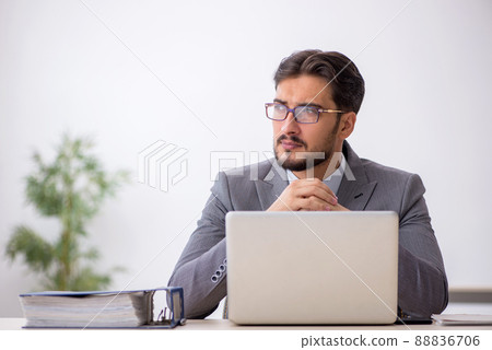 Young male employee working in the office 88836706